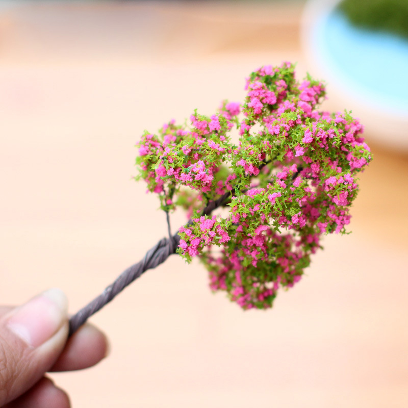 Moss micro landscape decoration with pink flowers and trees