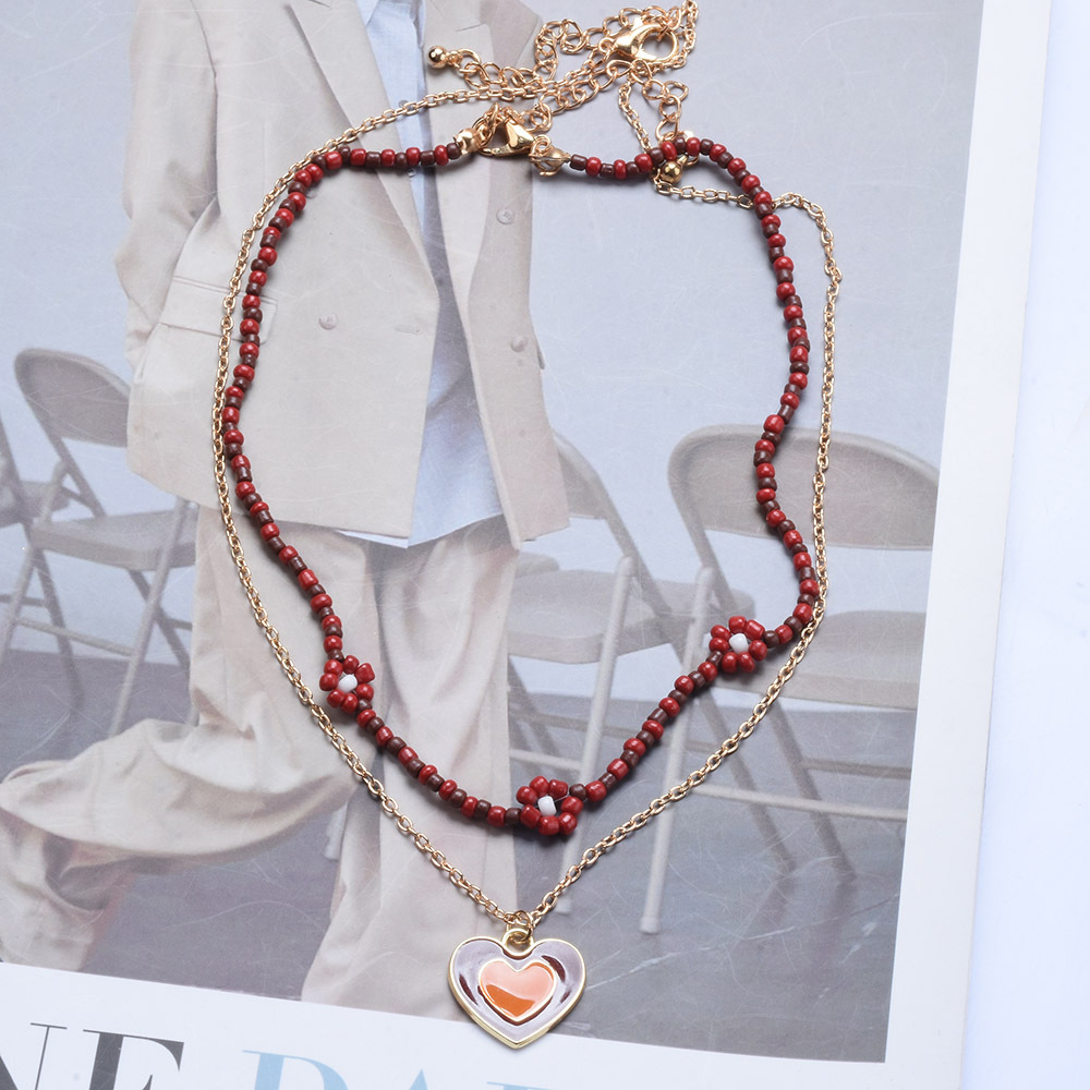 Chaîne de cou double couche chaîne de perles de soldes riz alliage longue chaîne pendentif amour